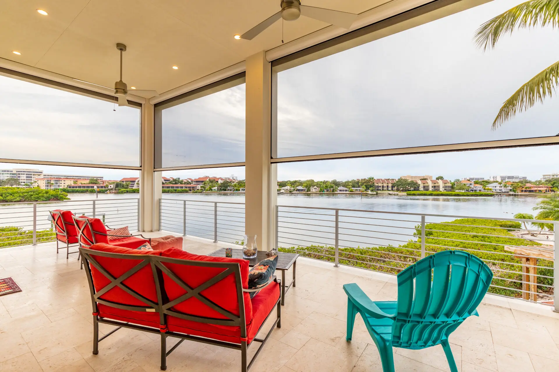 Modern porch enclosures featuring motorized vinyl panels for three-season climate control and pet-proof mesh base panels for a durable Troutman home addition.