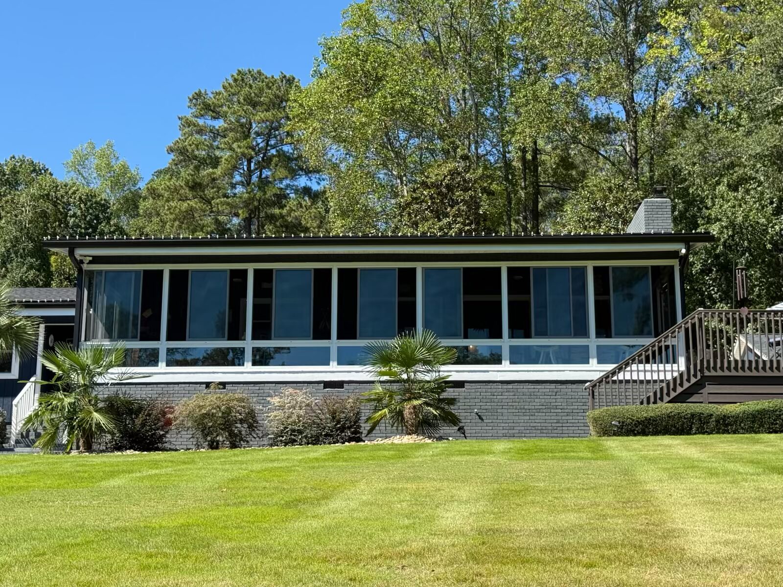 sunroom conversion on an existing patio covered with roof
